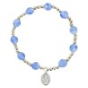 Bracelet dizainier sur élastique pour enfant avec grains œil de chat Ø 6 mm et médaille en métal de la Vierge Miraculeuse.