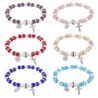 Bracelet sur élastique grains en verre Ø 8 mm avec médaille et croix. LOT DE 6 BRACELETS ASSORTIS.