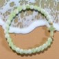 Bracelet élastique, perles en verre Ø 6 mm avec croix. Lot de 6 assortis.