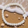 Bracelet élastique, perles en verre Ø 6 mm avec croix. Lot de 6 assortis.