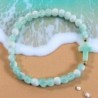 Bracelet élastique, perles en verre Ø 6 mm avec croix. Lot de 6 assortis.