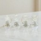 Ange en verre transparent, robe torsadée, ailes claires, H. 4 cm. Boîte individuelle, présentoir 12 pièces