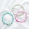 Bracelet élastique, perles en verre Ø 6 mm avec croix. Lot de 6 assortis.