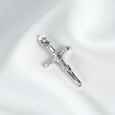 Croix avec Christ en argent 925 °/°° H. 2 cm. (0.89 g) Livré en boite