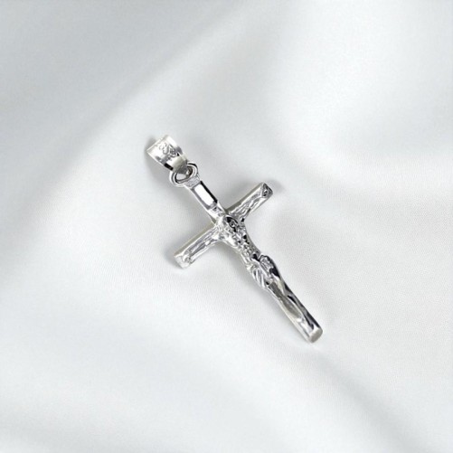 Croix avec Christ en argent 925 °/°° H. 2 cm. (0.89 g) Livré en boite