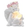 Ange en résine avec couronne de fleurs, lumineux. H. 10 x 6,5 cm.