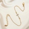 Bracelet en plaqué or ajustable avec croix OZ. Livré en boite