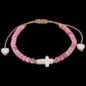 Bracelet sur corde réglable grains de forme cylindrique avec croix et coeur en coquille naturelle.