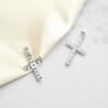 Croix en argent 925°/°° et OZ H 1.9 cm (1.3 g). Livré en boite