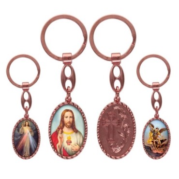 Porte-clés en aluminium de couleur cuivrée, hauteur 3,8 cm, avec résine. Disponible avec plusieurs saints au choix.