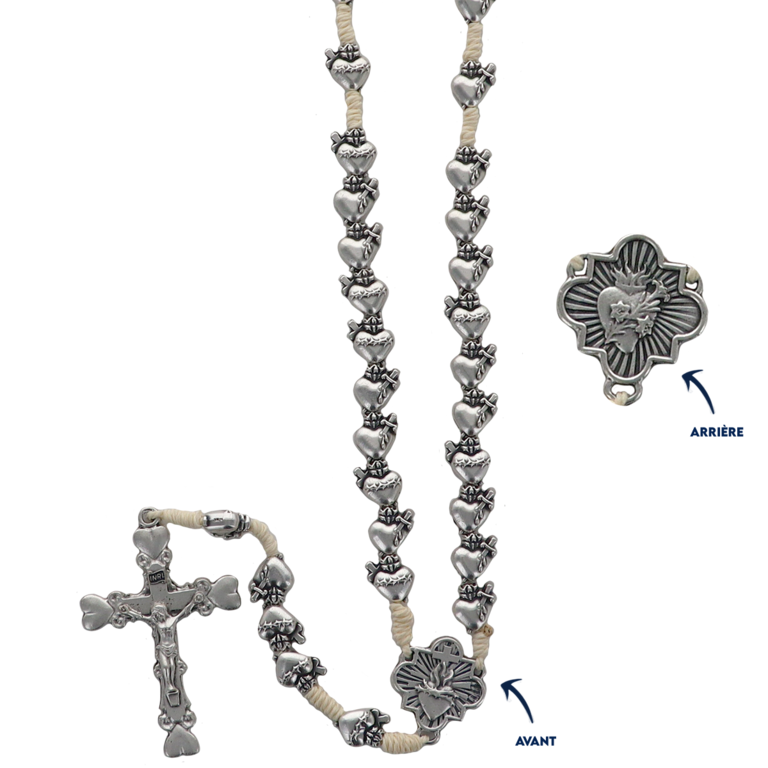 Chapelet métal de l'EX VOTO, grains Ø 8 mm sur corde, longueur juqu'au coeur 27 cm, croix avec Christ. Livré en boîte.